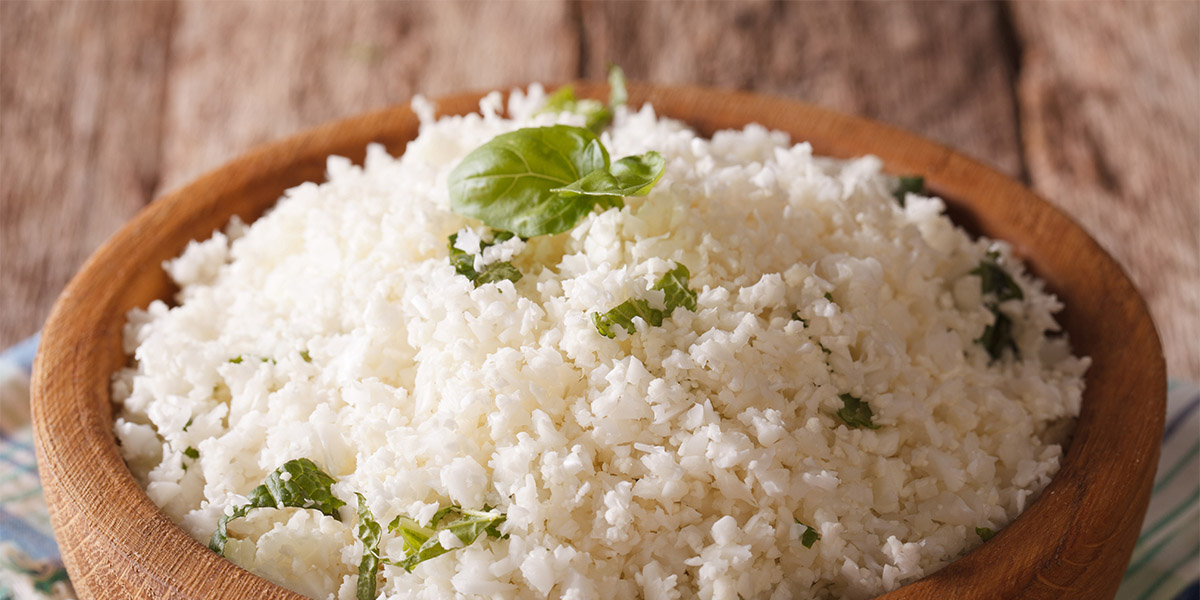 Paleo Food: Cauliflower rice with herbs close-up. horizontal