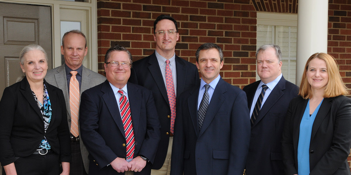 The physicians of Milestone Family Medicine standing in front of their medical practice