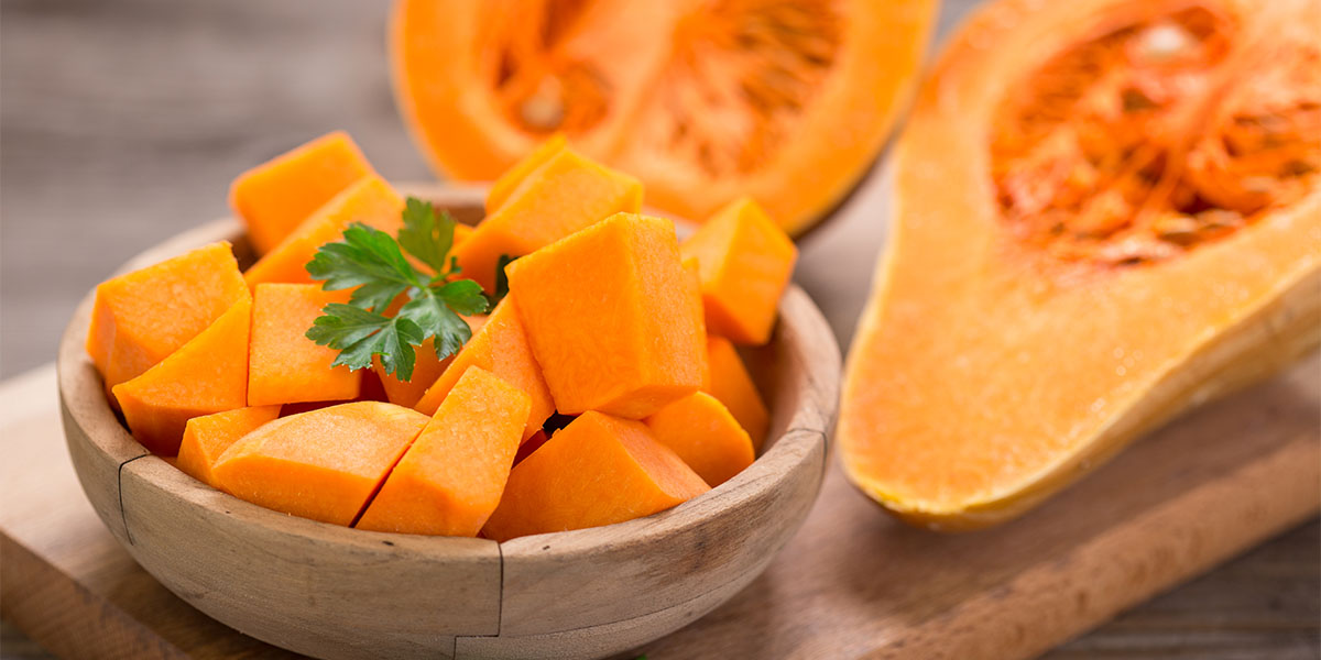 A bowl of winter squash diced and prepared to cook