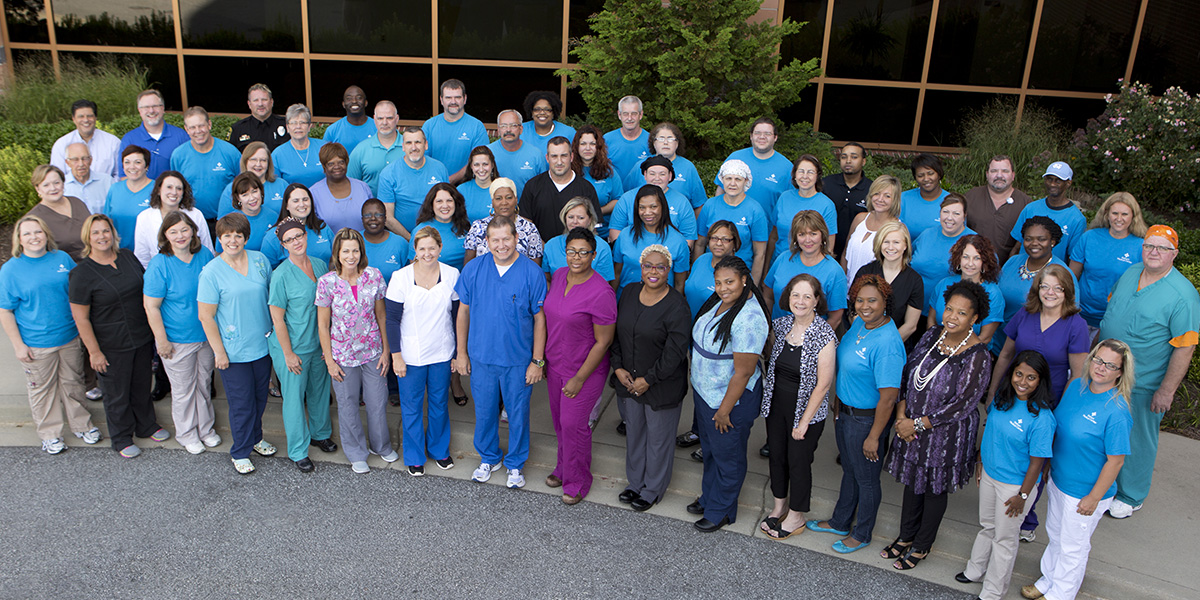 A group shot of about 60 Pelham Medical Center associates standing together