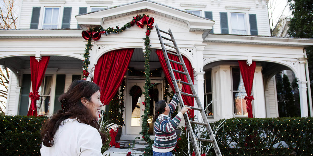 Middle aged couple decorating for the holidays