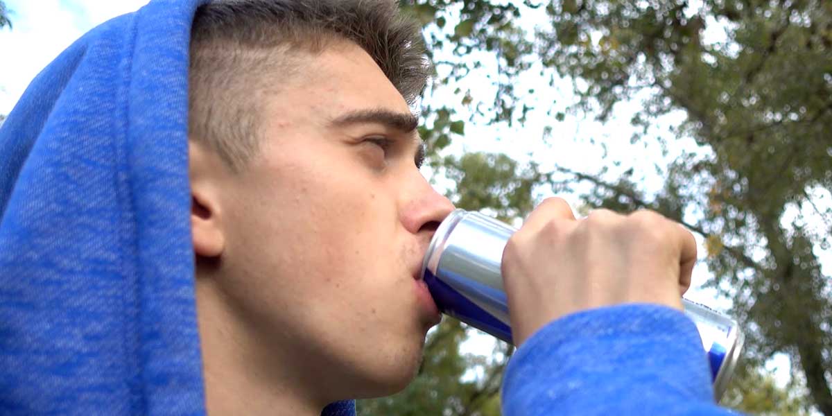 Young man drinking an energy drink