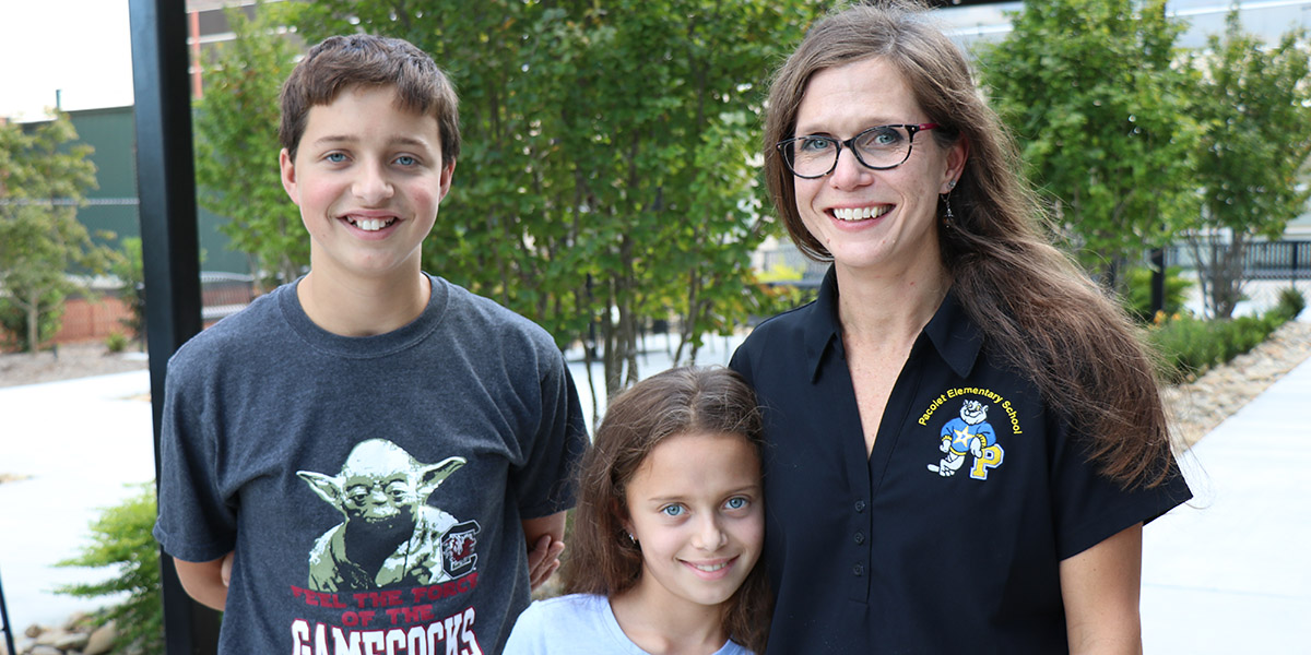 Holly Hartell poses with her daughter Sarah Marie and son JP