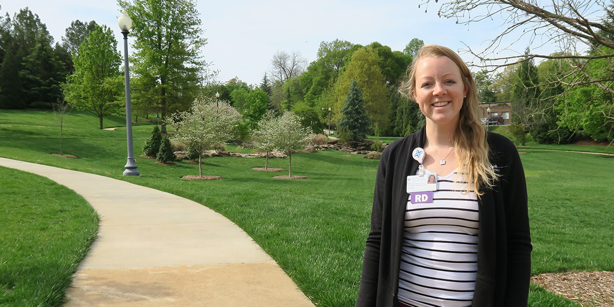 A registered dietician beside a walking path