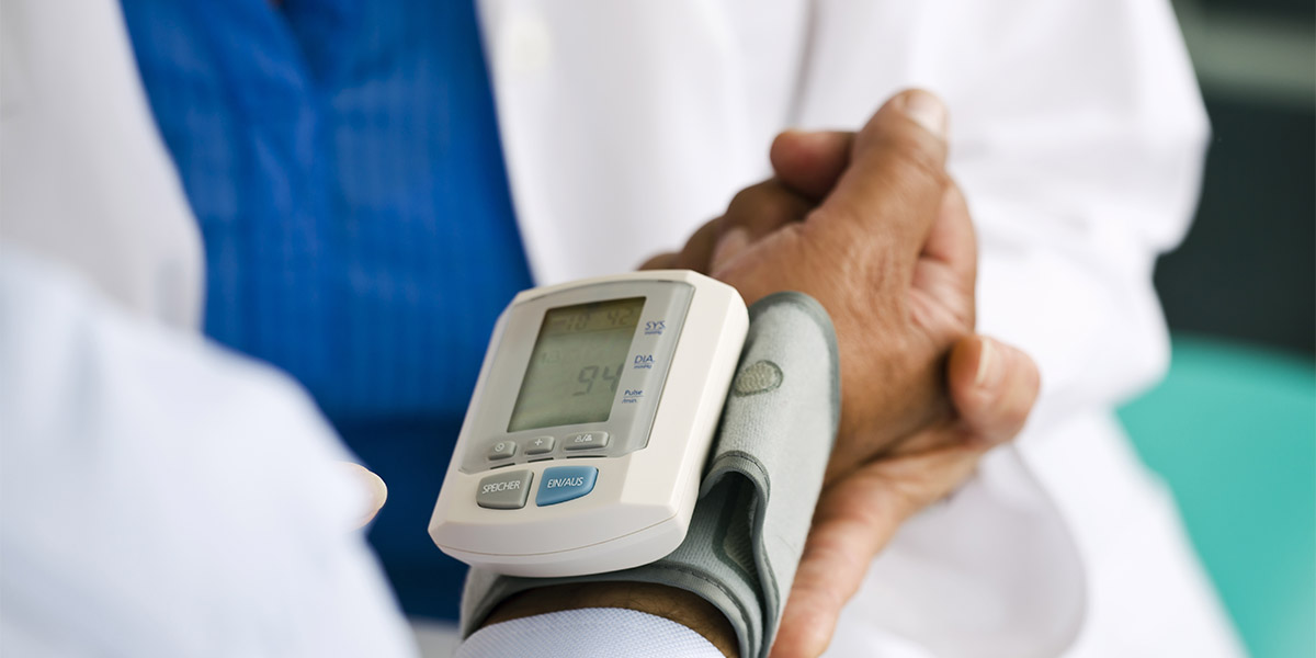 Doctor Checking the Blood Pressure of Her Patient