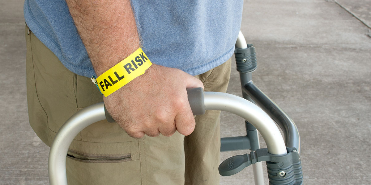 Handicapped Man Wearing A Fall Risk Bracelet