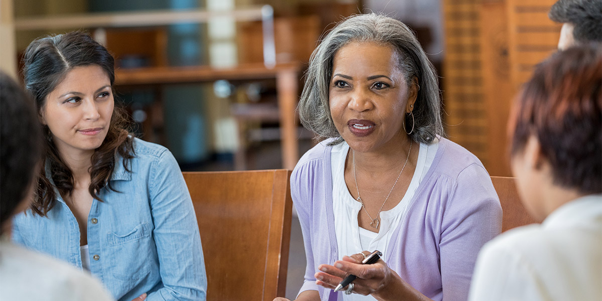 Senior mental health professional facilitates support group