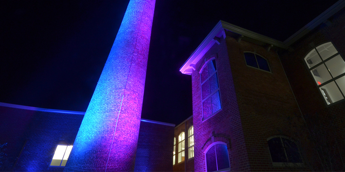 The Beaumont Mill smokestack is lit up purple as a public art exhibit called "Glow", through the Bloomberg Philanthropies Public Art Challenge - “Seeing Spartanburg in a New Light” 