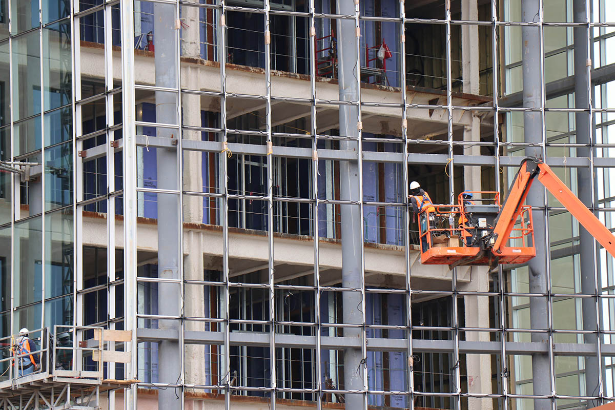 A contruction worker on a crane continues the work on the expansion of the Gibbs Cancer Center & Research Institute at Pelham in late March 2019..jpg