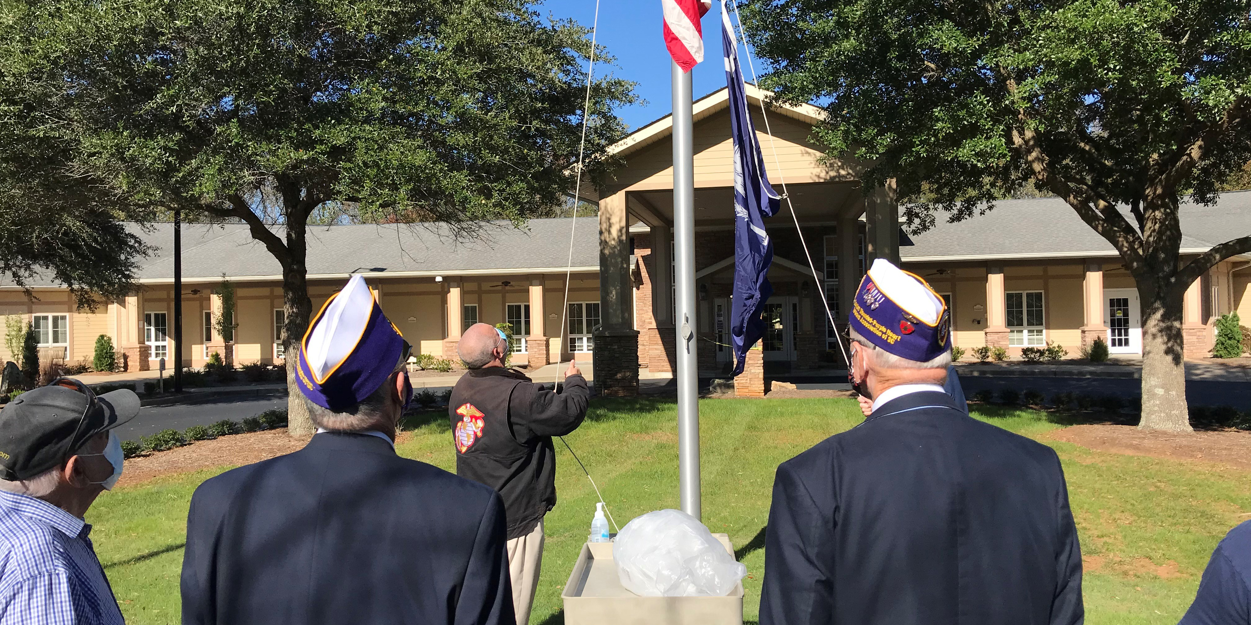 Spartanburg Regional Hospice Home raises a flag in celebration of Veteran's Day