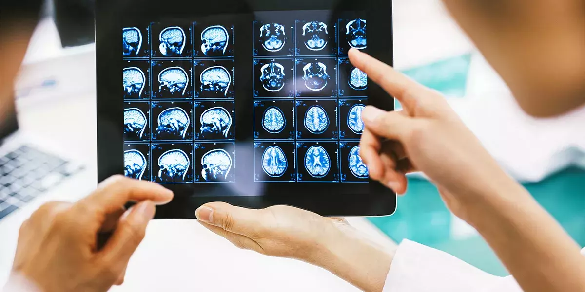 Doctor and patient using digital tablet in hospital