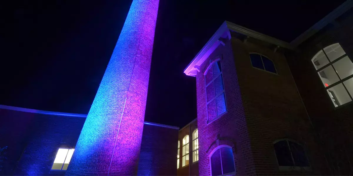 The Beaumont Mill smokestack is lit up purple as a public art exhibit called "Glow", through the Bloomberg Philanthropies Public Art Challenge - “Seeing Spartanburg in a New Light”