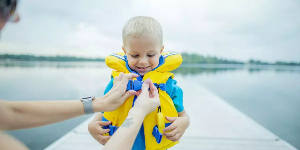 Helping Son With Life Jacket