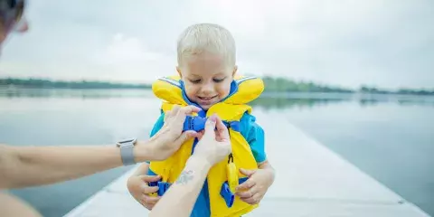 Helping Son With Life Jacket